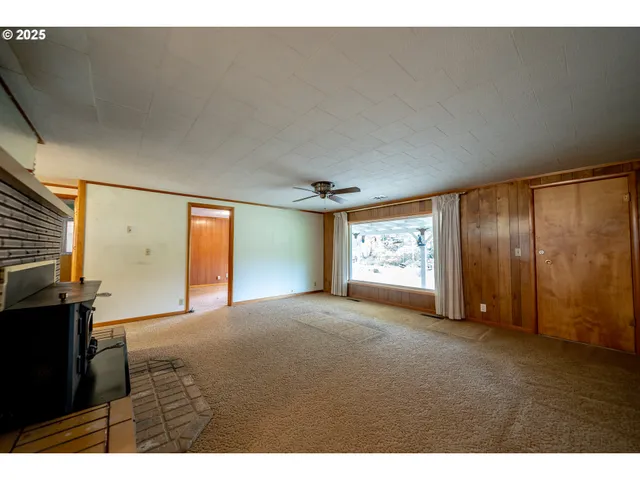 view of an empty room with a window