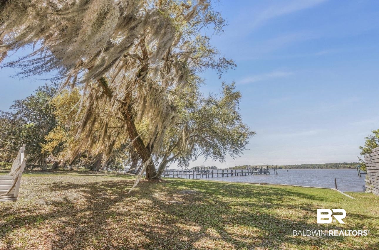 11326 County Road 26 Foley, AL 36535 - Photo 10 of 20 View of grassy yard featuring a water view and a dock