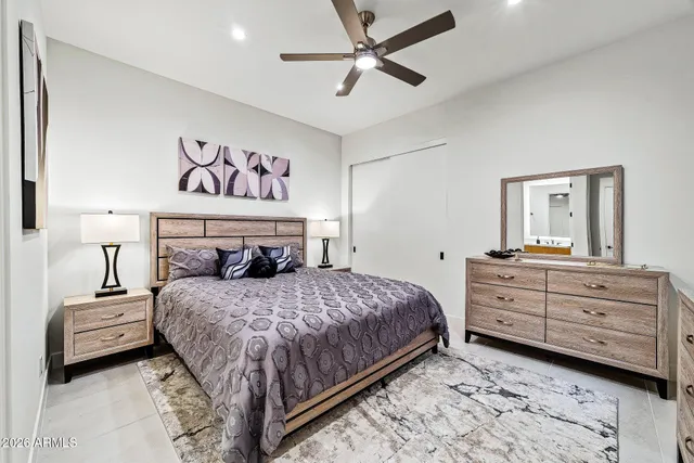 a bedroom with a bed and a tv