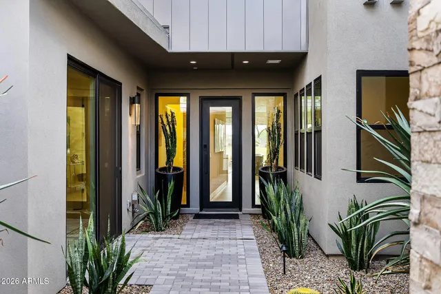 a large kitchen with kitchen island a dining table and chairs