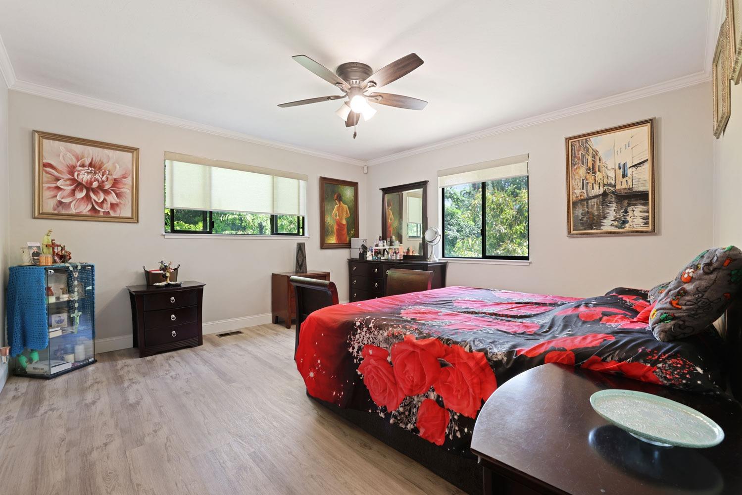 5348 Shippee Lane Stockton, CA 95212 - Photo 11 of 35 a bed room with a bed and a fish tank