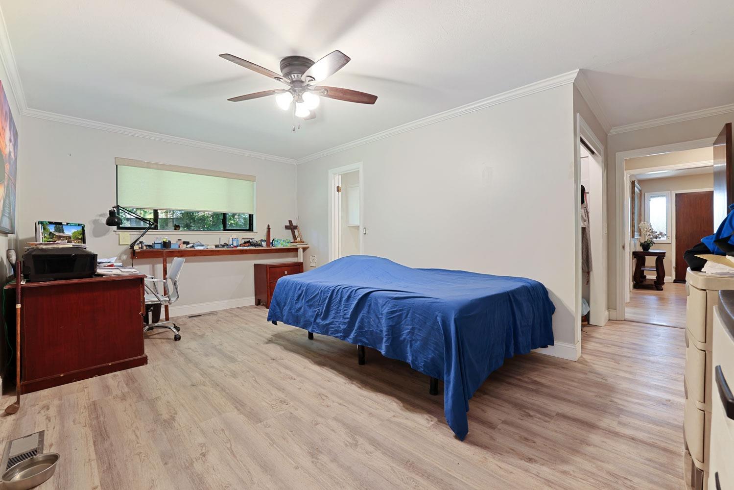 5348 Shippee Lane Stockton, CA 95212 - Photo 17 of 35 a spacious bedroom with a bed and a table