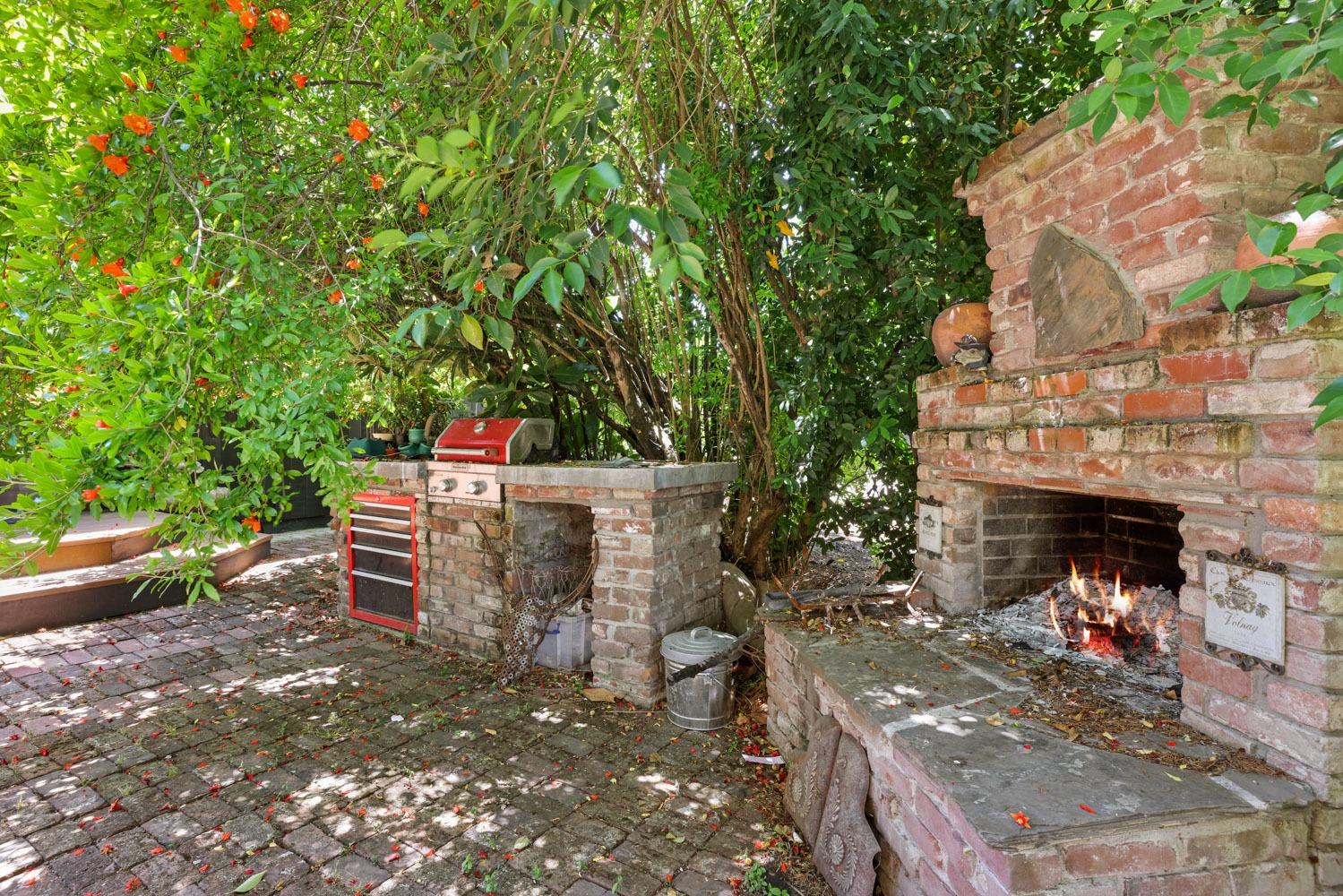 5348 Shippee Lane Stockton, CA 95212 - Photo 32 of 35 a view of a patio with table and chairs potted plants and a large tree