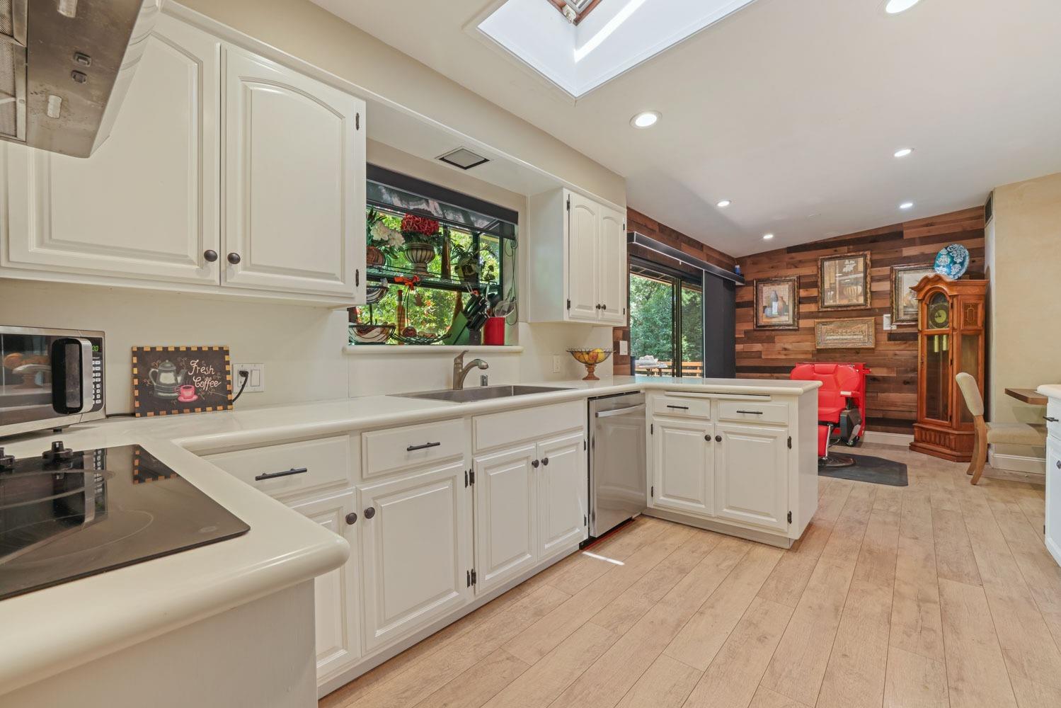 5348 Shippee Lane Stockton, CA 95212 - Photo 6 of 35 a kitchen that has a sink and a stove in it