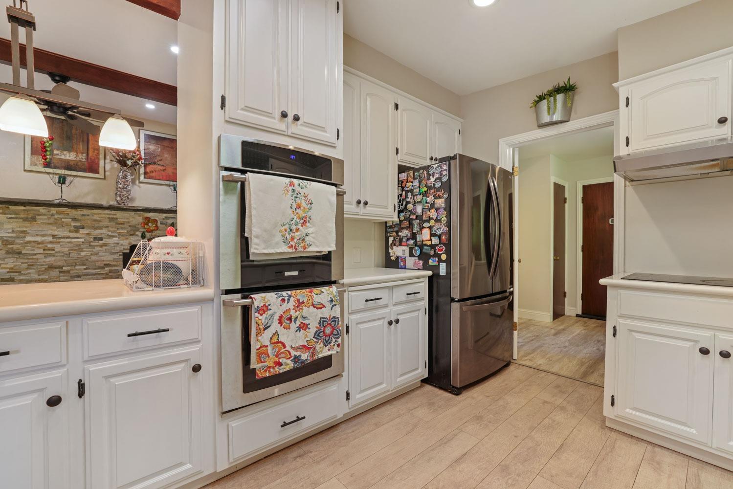 5348 Shippee Lane Stockton, CA 95212 - Photo 7 of 35 a kitchen with stainless steel appliances granite countertop a refrigerator and a stove