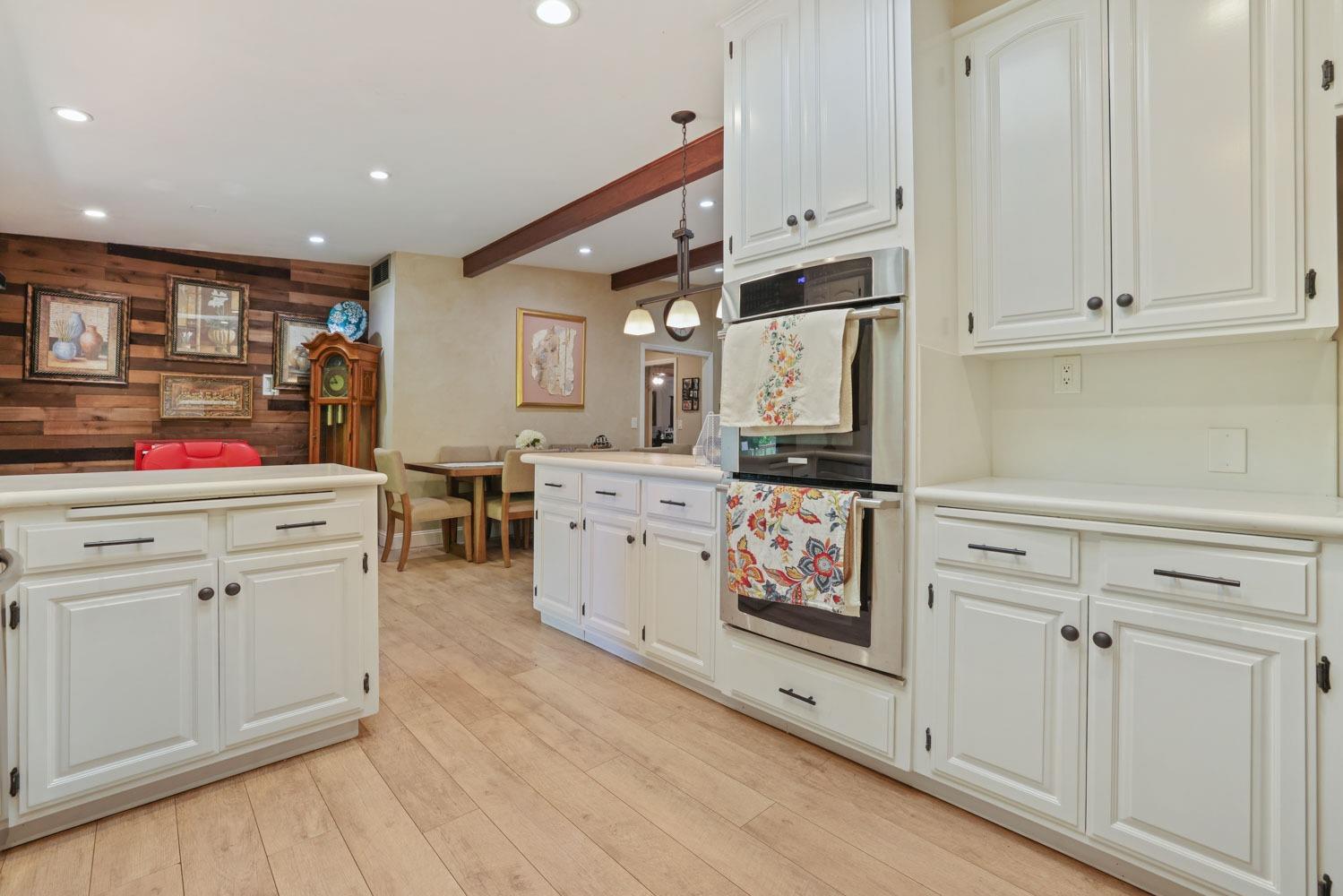 5348 Shippee Lane Stockton, CA 95212 - Photo 8 of 35 a kitchen with granite countertop white cabinets and white appliances