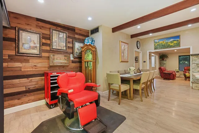 a dining room with furniture and wooden floor