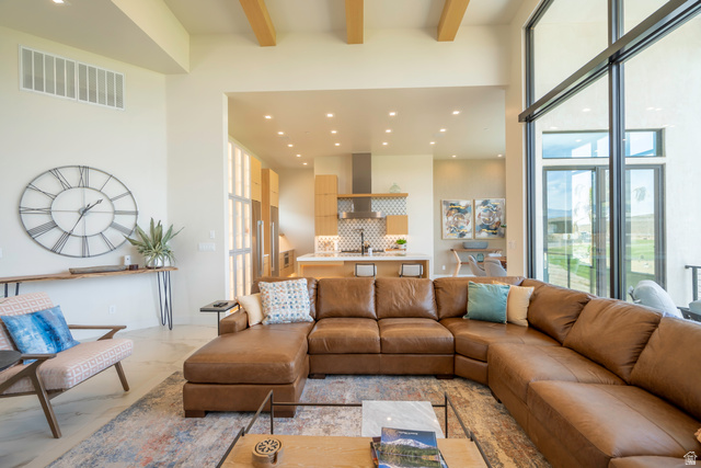 3606 South Cypress Road Hurricane, UT 84737 - Photo 17 of 69 Living room featuring recessed lighting, plenty of natural light, and light marble finish flooring