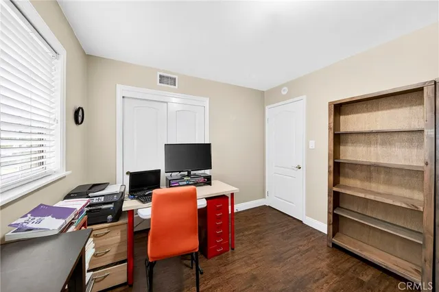 a workspace with furniture and window