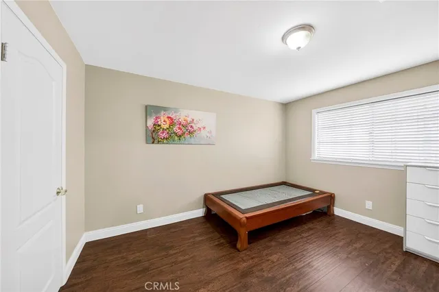 a bench sitting in a room next to a window