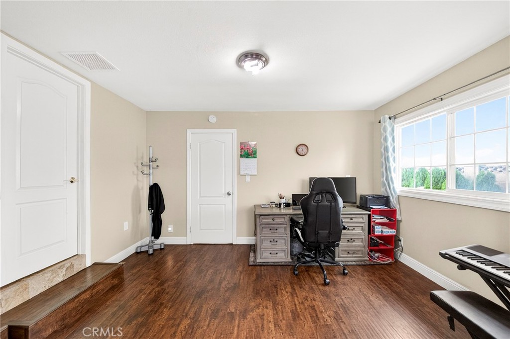 15243 Crosswood Road La Mirada, CA 90638 - Photo 25 of 44 a view of a workspace with furniture and a window