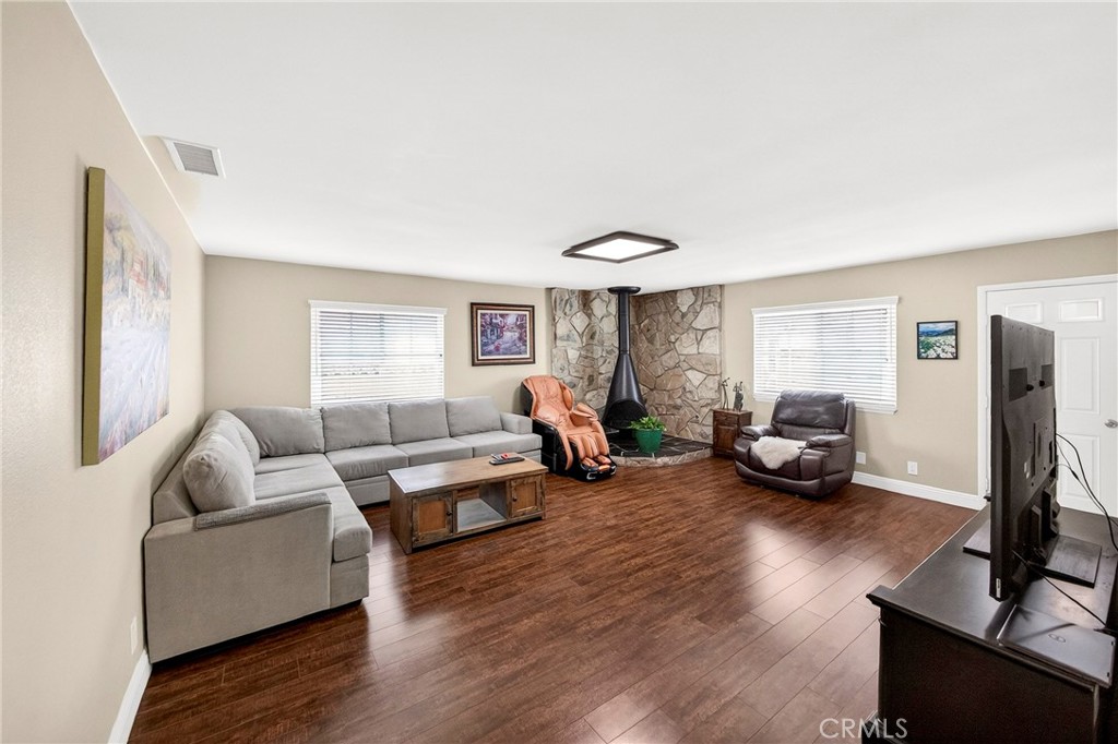 15243 Crosswood Road La Mirada, CA 90638 - Photo 35 of 44 a living room with furniture and a wooden floor