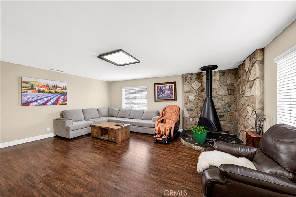 15243 Crosswood Road La Mirada, CA 90638 - Photo 37 of 44 a living room with furniture two window and a wooden floor