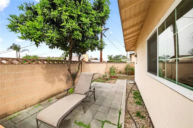 a view of a balcony with lake view and a floor to ceiling window next to a yard