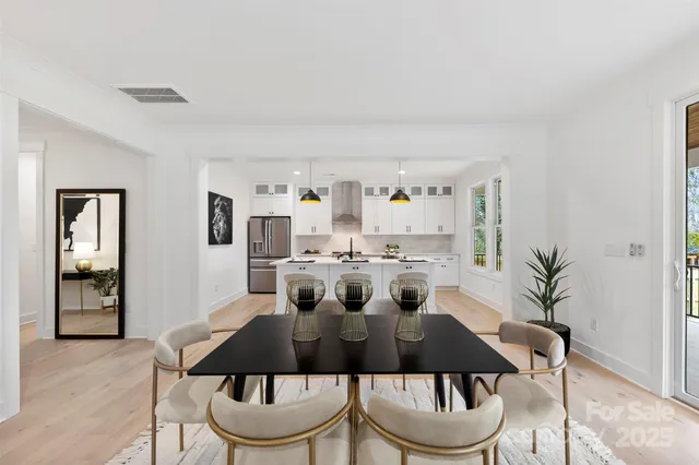 a view of a dining room with furniture and window