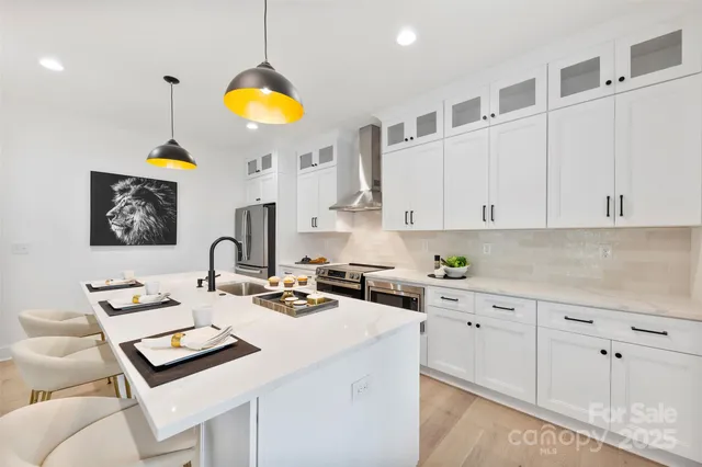 a kitchen with cabinets a counter and appliances