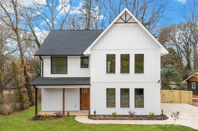 a view of house with yard