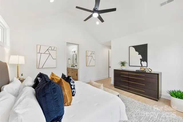 a bathroom with double vanity sinks and a mirror