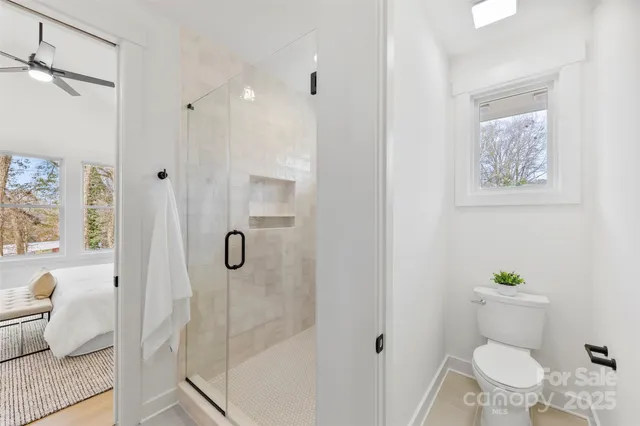 a bathroom with double vanity sinks and a mirror