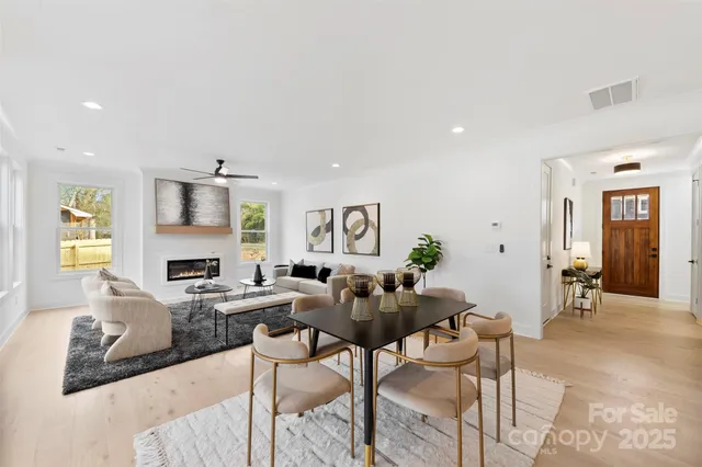 a living room with fireplace furniture and a window