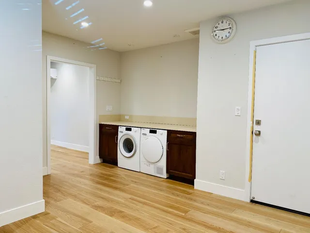 a view of a storage & utility room with washer and dryer