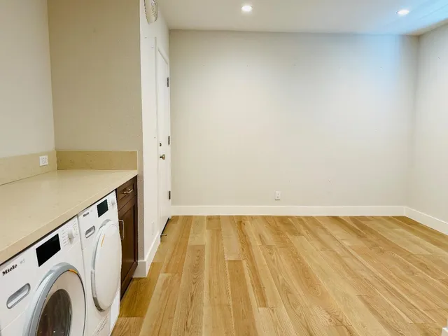 a view of storage and utility room with washer and dryer