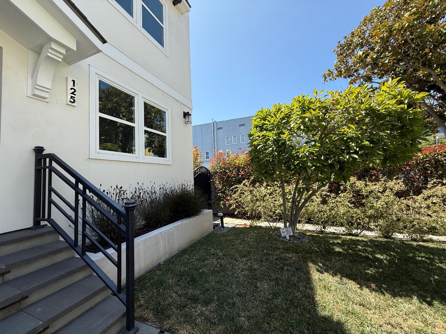 125 Park Road, Unit B Burlingame, CA 94010 - Photo 13 of 13 a view of a house with a yard