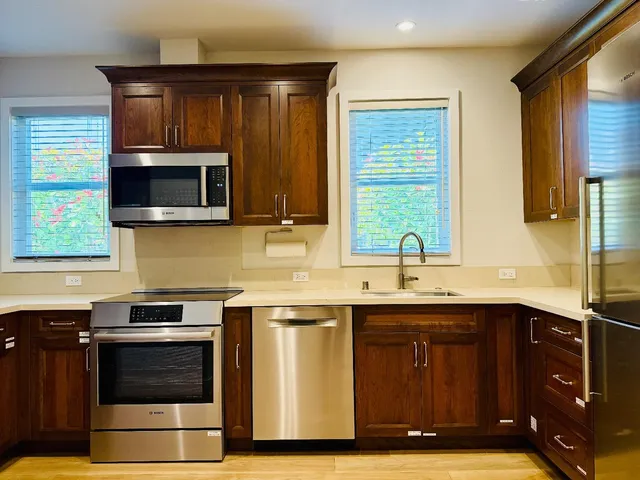 a kitchen with a sink and a microwave
