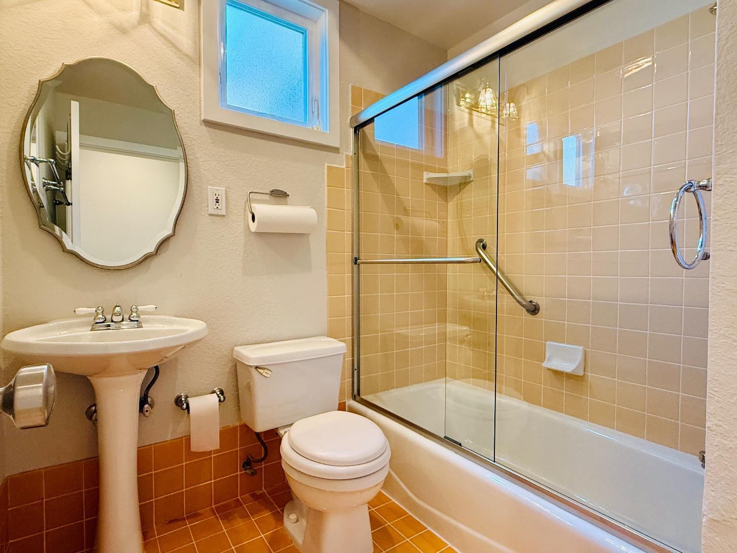 125 Park Road, Unit B Burlingame, CA 94010 - Photo 10 of 13 a bathroom with a sink toilet and shower