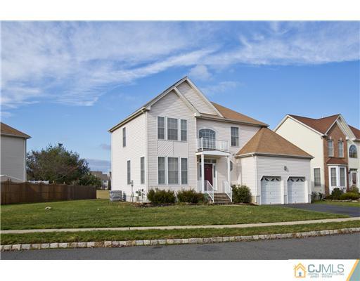 41 Timber Ridge Road North Brunswick, NJ 08902 - Photo 22 of 25 a front view of a house with a yard