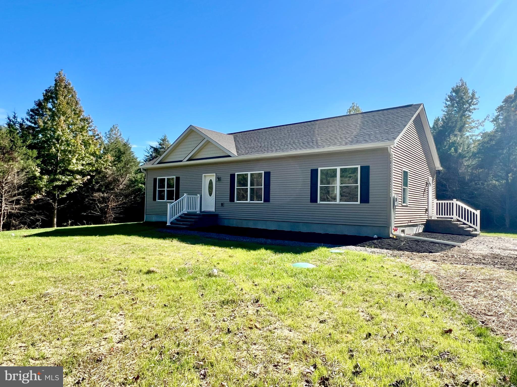 a house with trees in the background