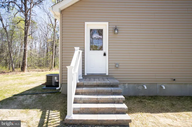 a view of a patio with a table and chairs