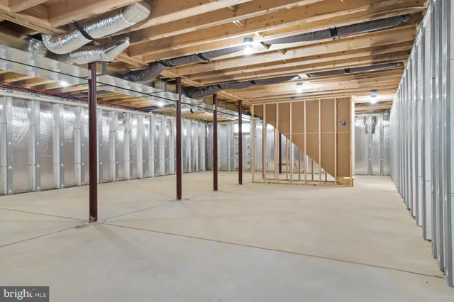 a view of an empty room with wooden walls