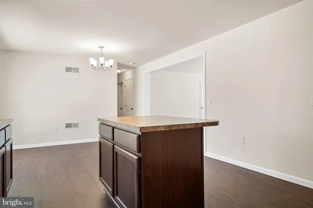 an empty room with a mirror