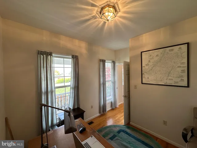 a kitchen with granite countertop a refrigerator and a sink