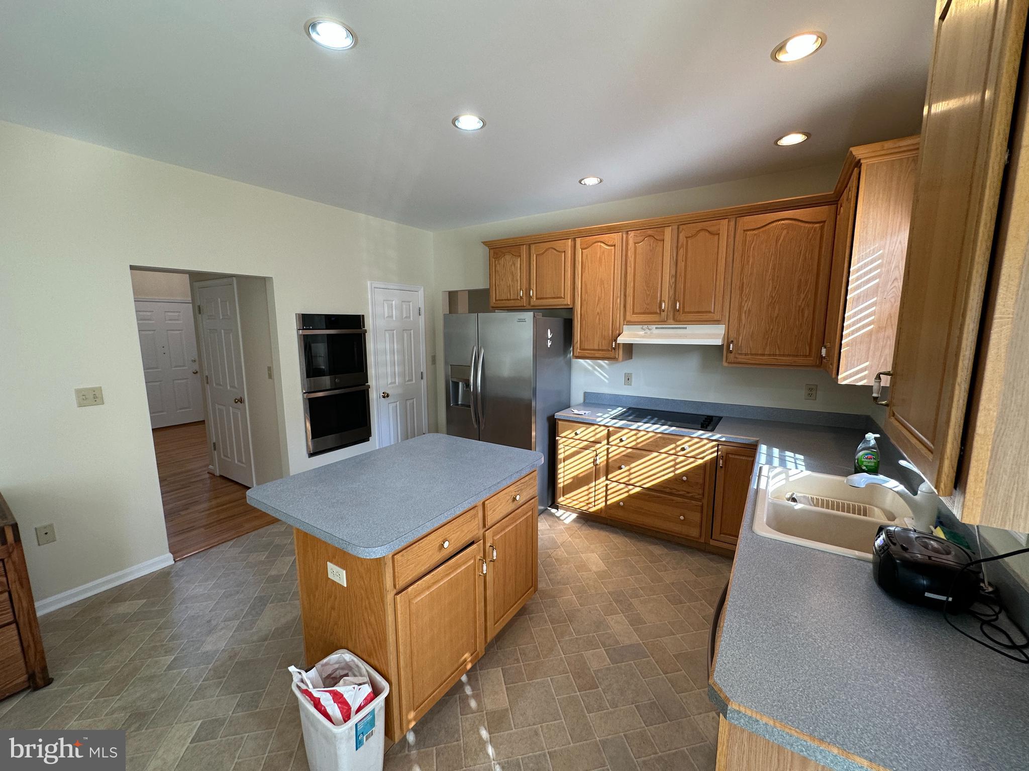 201 Vista Lane White Post, VA 22663 - Photo 32 of 61 a kitchen with granite countertop a refrigerator and a sink