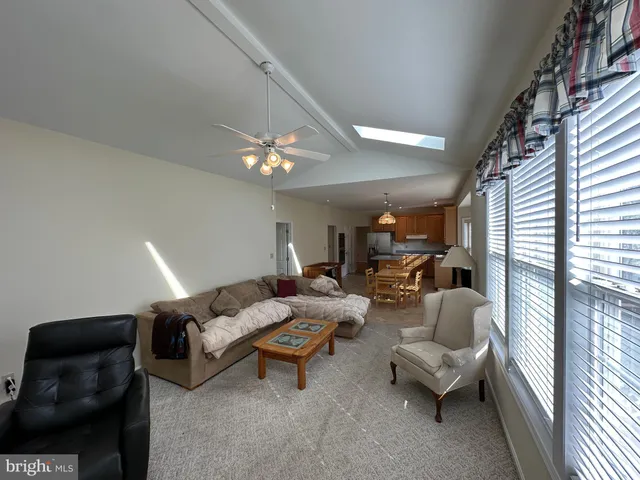 a bedroom with two beds and window