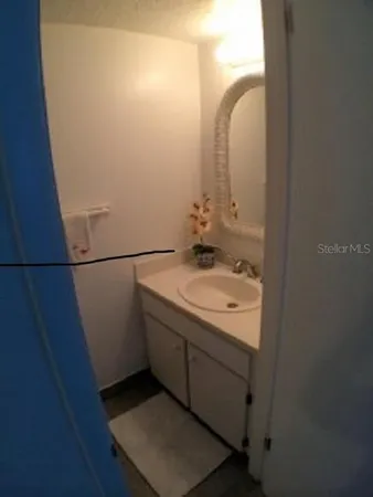 a bathroom with a sink and mirror