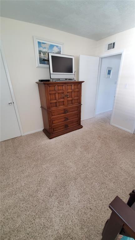 815 Ocean Shore Boulevard, Unit 11A Ormond Beach, FL 32176 - Photo 9 of 10 a view of an empty room with windows