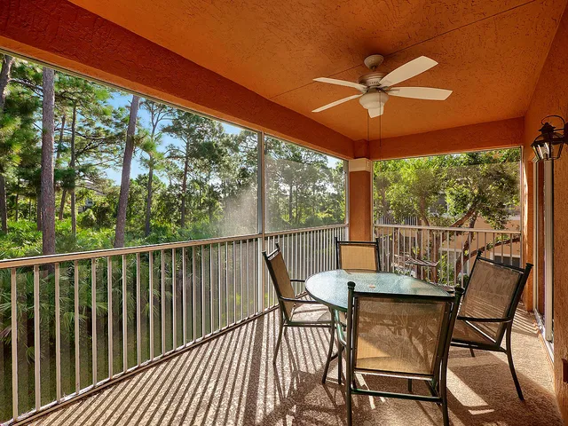 a view of a two chairs in the balcony