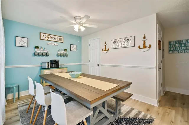 a kitchen with kitchen island a refrigerator stove and microwave