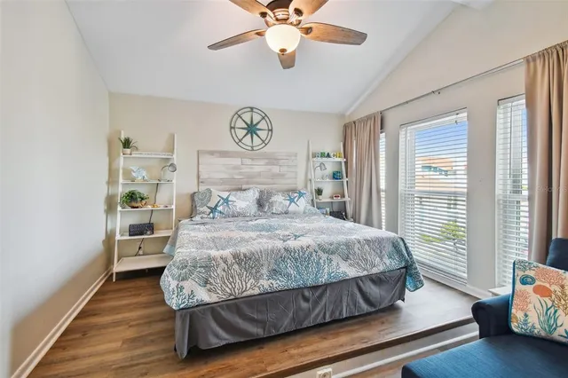 a room with furniture a window and a glass door shower