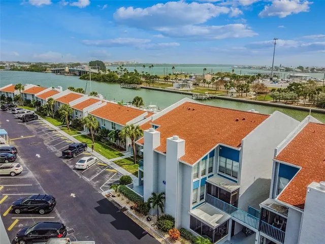 an aerial view of a house with outdoor space swimming pool and ocean view