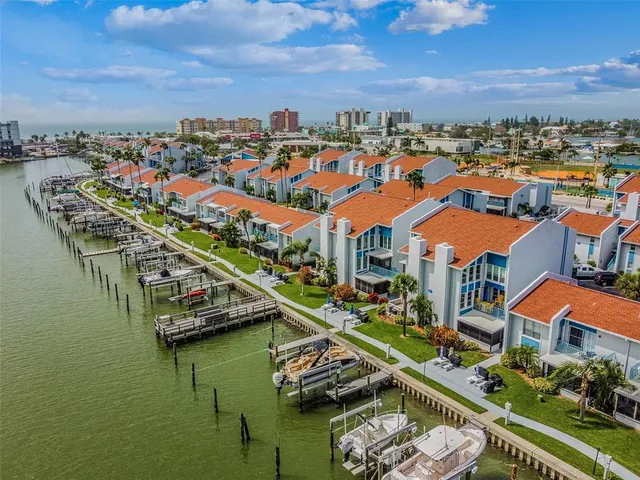an aerial view of a house with a swimming pool yard and outdoor seating