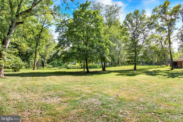 a view of a deck with wooden floor and seating space
