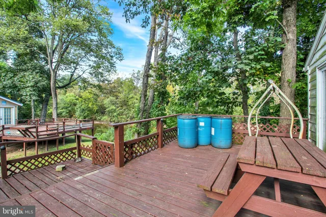 a backyard of a house with yard fountain and outdoor seating