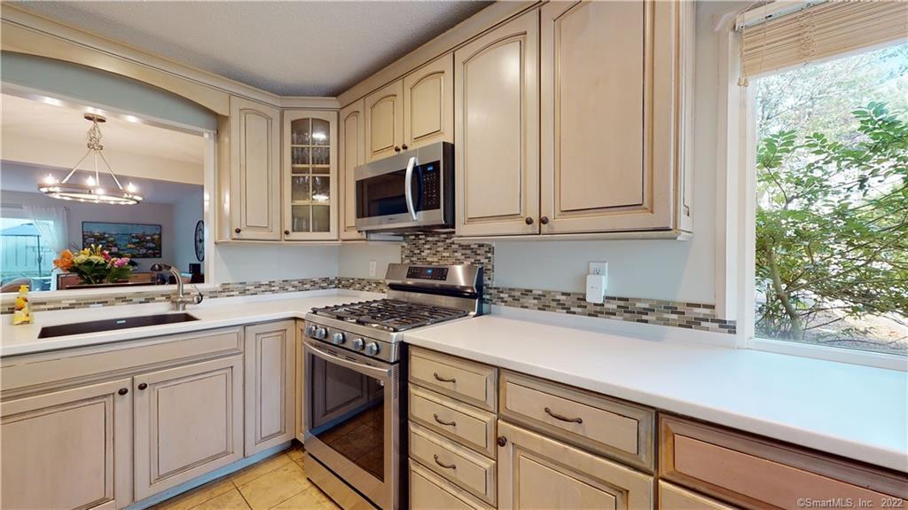 Rarely Available! You will enjoy entertaining Your Friends and Family in this Updated Open Concept Spacious End Unit Townhouse in the Highly Sought After Talcott Glen Complex!