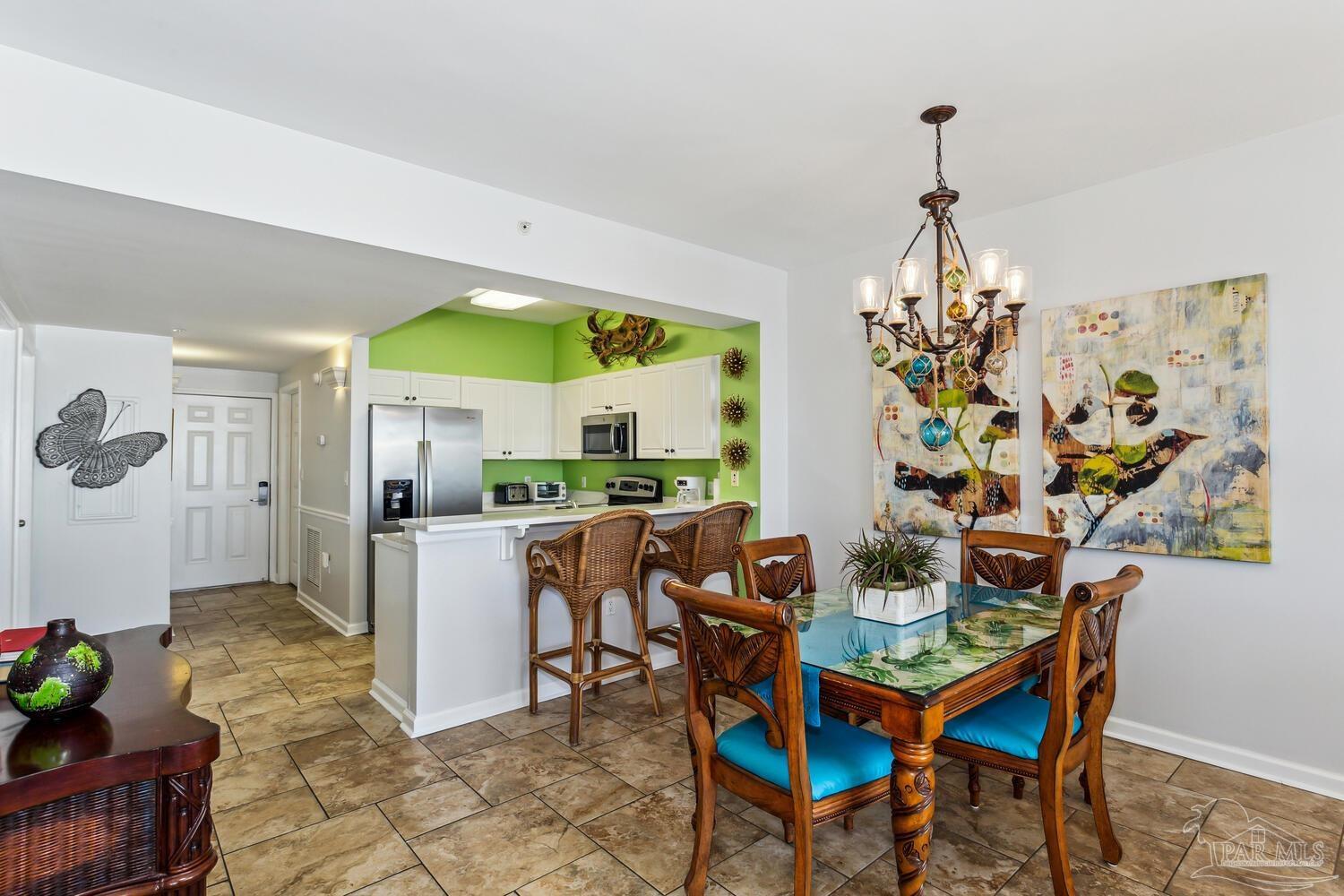 14511 Perdido Key Drive, Unit 1303 Perdido Key, FL 32507 - Photo 19 of 58 a view of a dining room with furniture and chandelier