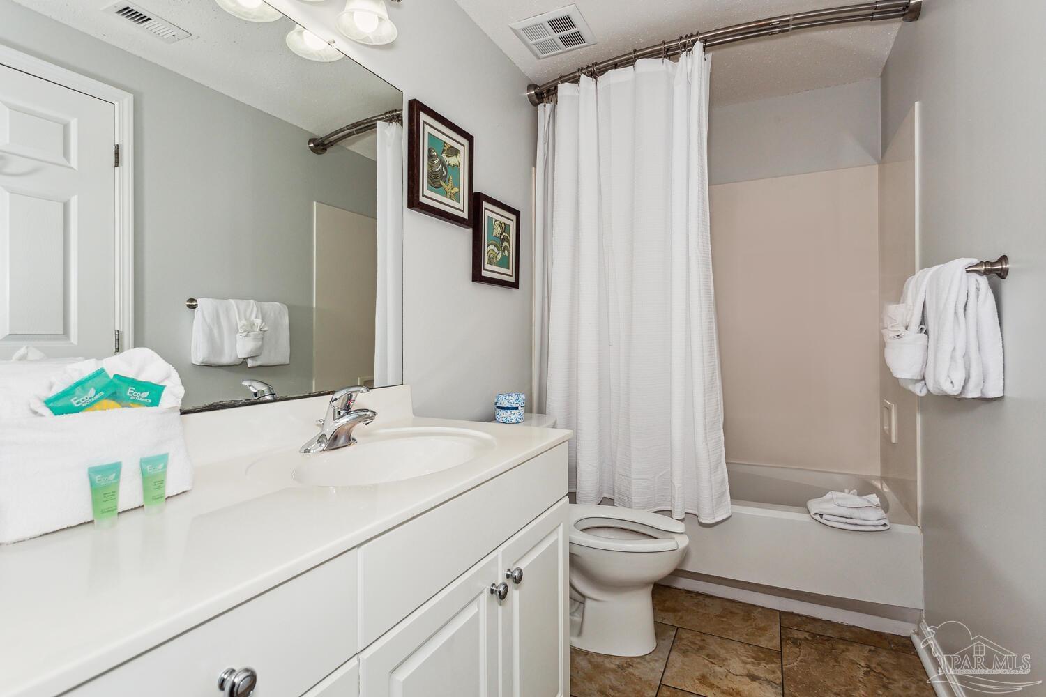 14511 Perdido Key Drive, Unit 1303 Perdido Key, FL 32507 - Photo 25 of 58 a bathroom with a sink toilet and shower
