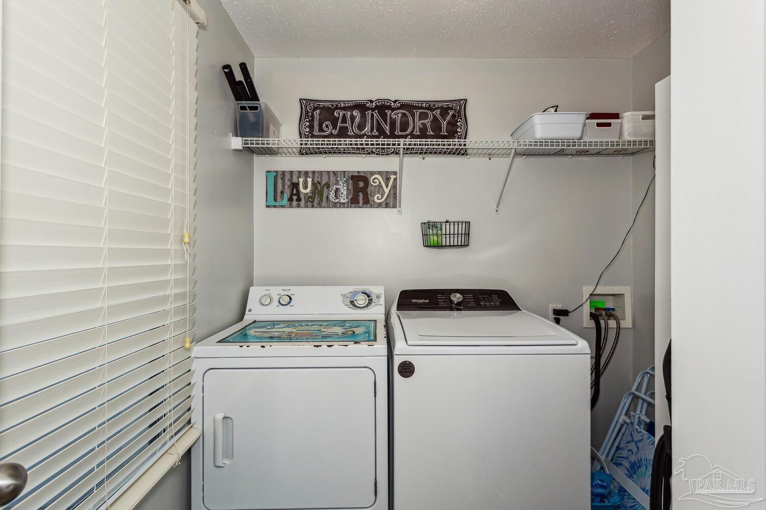 14511 Perdido Key Drive, Unit 1303 Perdido Key, FL 32507 - Photo 29 of 58 a utility room with dryer and washer